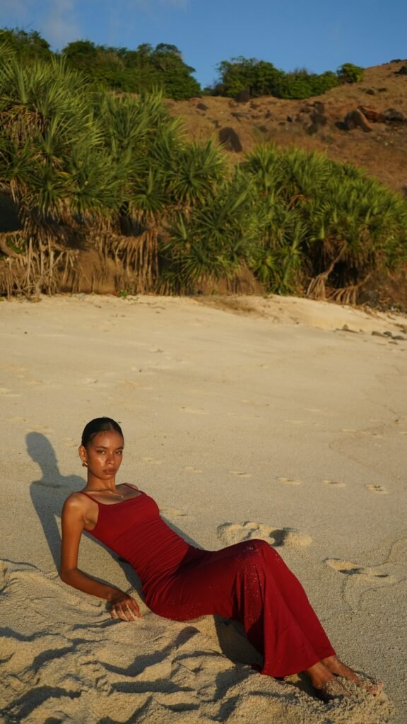 Woman on tropical beach in Indonesia - UV sun protection clothing for tropical climates